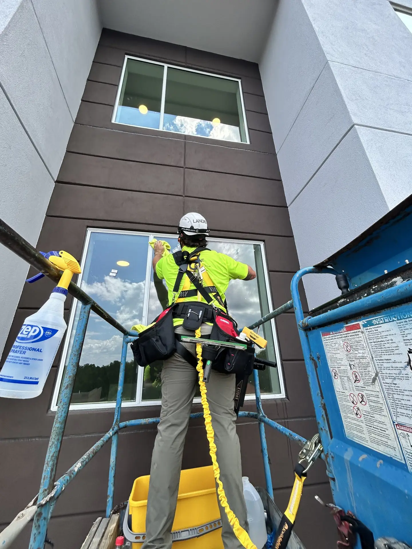 Mid-rise exterior window cleaning using lift access equipment in Raleigh North Carolina